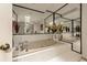 Bathroom with a large bathtub and skylight at 9525 Mcnorton Rd, Altamonte Springs, FL 32714