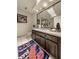 Bathroom with dark vanity, granite countertop and large mirror at 9525 Mcnorton Rd, Altamonte Springs, FL 32714
