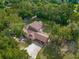 Aerial view of house nestled in lush, green trees at 9525 Mcnorton Rd, Altamonte Springs, FL 32714