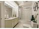Clean bathroom with a shower/tub combo, vanity, and updated lighting at 9525 Mcnorton Rd, Altamonte Springs, FL 32714