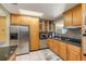 Modern kitchen with stainless steel appliances and wood cabinets at 9525 Mcnorton Rd, Altamonte Springs, FL 32714