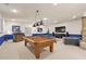 Game room boasts pool table, sectional sofa and large TV at 9525 Mcnorton Rd, Altamonte Springs, FL 32714