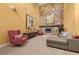 Spacious living room with a stone fireplace, sectional sofa, and high ceilings at 9525 Mcnorton Rd, Altamonte Springs, FL 32714