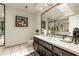Bathroom with dark vanity, granite countertop and large mirror at 9525 Mcnorton Rd, Altamonte Springs, FL 32714