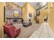 Open living area with a stone fireplace, spiral staircase, and high ceilings at 9525 Mcnorton Rd, Altamonte Springs, FL 32714