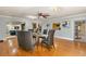 Open concept dining room with hardwood floors and seating for six at 9525 Mcnorton Rd, Altamonte Springs, FL 32714