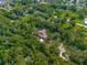 House surrounded by trees, aerial view at 9525 Mcnorton Rd, Altamonte Springs, FL 32714