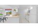 Kitchen with white cabinets, a breakfast bar and view at 1150 Carmel Cir # 408, Casselberry, FL 32707