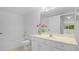Clean bathroom with a single sink vanity, bathtub, and toilet at 1150 Carmel Cir # 408, Casselberry, FL 32707