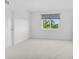 Bright bedroom featuring neutral carpeting and a window with a view at 1150 Carmel Cir # 408, Casselberry, FL 32707