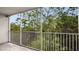 Private screened balcony overlooking lush green trees at 1150 Carmel Cir # 408, Casselberry, FL 32707