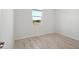 Simple bedroom with tile flooring and a window at 27512 Stellar Sea Way, Howey In The Hills, FL 34737