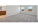 Bright bedroom with plush carpet and large windows offering a view at 27512 Stellar Sea Way, Howey In The Hills, FL 34737