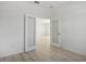 Open hallway with frosted glass doors at 27512 Stellar Sea Way, Howey In The Hills, FL 34737