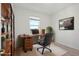 Bright home office features built-in shelving and a large desk at 27512 Stellar Sea Way, Howey In The Hills, FL 34737