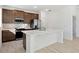 Modern kitchen with stainless steel appliances and island at 27512 Stellar Sea Way, Howey In The Hills, FL 34737