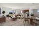 Virtually staged living room and dining area with hardwood floors at 27512 Stellar Sea Way, Howey In The Hills, FL 34737