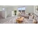 Spacious living room with sectional sofa and wood coffee table at 27512 Stellar Sea Way, Howey In The Hills, FL 34737