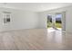Living room with tile floors and sliding glass doors to backyard at 27512 Stellar Sea Way, Howey In The Hills, FL 34737