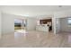 Bright and spacious living room with tile flooring and sliding doors at 27512 Stellar Sea Way, Howey In The Hills, FL 34737