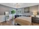 Bright bedroom with wood-look flooring, and neutral decor at 551 Cidermill Pl, Lake Mary, FL 32746