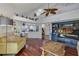 Open living space with hardwood floors, kitchen island, and a lofted area at 551 Cidermill Pl, Lake Mary, FL 32746