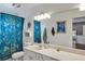 Clean bathroom with teal shower curtain and updated vanity at 551 Cidermill Pl, Lake Mary, FL 32746