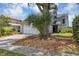 Gray two-story house with a white garage door and landscaping at 551 Cidermill Pl, Lake Mary, FL 32746