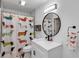 Modern bathroom with white vanity, walk-in shower, and dachshund-themed decor at 551 Cidermill Pl, Lake Mary, FL 32746