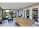 Spacious screened patio with tiled floors and access to the backyard at 551 Cidermill Pl, Lake Mary, FL 32746
