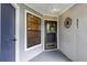Front door entrance to condo with yellow wreath and metal wall decor at 551 Cidermill Pl, Lake Mary, FL 32746