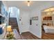 Bright condo entryway with stairs, console table, and artwork at 551 Cidermill Pl, Lake Mary, FL 32746
