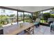 Relaxing screened patio overlooking a lake, perfect for outdoor dining at 551 Cidermill Pl, Lake Mary, FL 32746