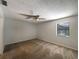 Spacious bedroom with neutral carpeting and a ceiling fan at 3235 Cross Fox Dr, Mulberry, FL 33860
