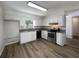 Renovated kitchen showcasing modern appliances and granite countertops at 3235 Cross Fox Dr, Mulberry, FL 33860