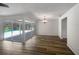 Bright dining room with wood-look flooring and pool views at 3235 Cross Fox Dr, Mulberry, FL 33860
