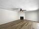 Living area featuring a fireplace and wood-look flooring at 3235 Cross Fox Dr, Mulberry, FL 33860