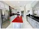 Modern kitchen with stainless steel appliances and an island at 9060 Heritage Bay Cir, Orlando, FL 32836