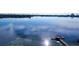 Stunning aerial view of a lakefront property with a dock at 9060 Heritage Bay Cir, Orlando, FL 32836
