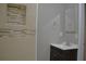 Updated bathroom with a vanity, tiled shower, and mosaic accent at 647 S Delaware Ave, Deland, FL 32720