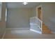 Versatile bonus room with stairs and neutral decor at 647 S Delaware Ave, Deland, FL 32720