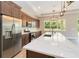 Kitchen features white quartz countertops and stainless steel appliances at 2060 Watersedge Dr, Deltona, FL 32738