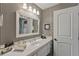 Bathroom with black and white checkered wallpaper and white vanity at 1750 Taylor Woods Rd, Deland, FL 32724
