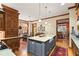Eat-in kitchen with island, hardwood floors, and view to Gathering room at 1750 Taylor Woods Rd, Deland, FL 32724