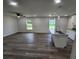 Open concept living room and kitchen with vinyl plank flooring throughout at 2220 Church St, Sanford, FL 32771