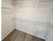 Large walk-in closet with wire shelving for hanging clothes at 2220 Church St, Sanford, FL 32771