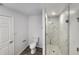 Bathroom with toilet, granite shower, and vinyl plank flooring at 2220 Church St, Sanford, FL 32771