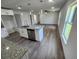 Modern kitchen with white cabinets, granite countertops and stainless steel dishwasher at 2220 Church St, Sanford, FL 32771