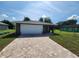 Newly built home with a paved driveway and attached garage at 2220 Church St, Sanford, FL 32771