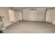 Garage with an overhead door, water heater, and access to the house at 2220 Church St, Sanford, FL 32771